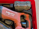a red tool box with tools in it on the floor