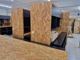 a room that has a lot of plywood boards on the walls