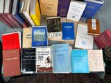 a lot of books that are sitting on a table