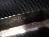 a close up of a metal pan with a handle
