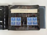 a picture of a set of four stamps in a case