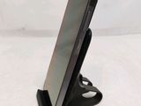 a cell phone that is sitting on a stand