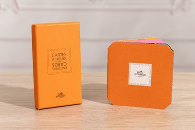 an orange box with a white label sitting next to an orange box with a white label