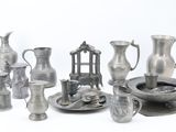 a lot of silver items that are on a table