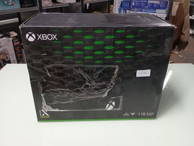 the box for the xbox game console is sitting on the table