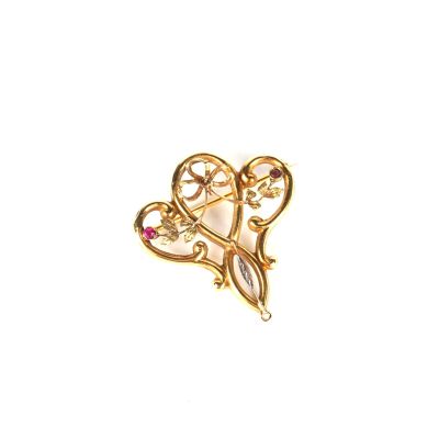 une image représentant une paire de ciseaux avec des pierres roses au milieu