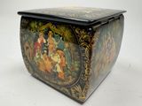 a decorative box with a painting on it on a white surface