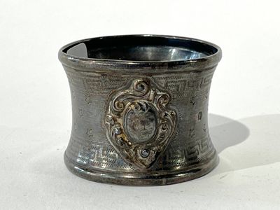 a silver cup that is sitting on a table