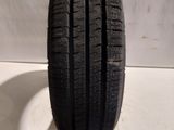 a close up of a tire on a white surface