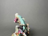 an image of a figurine of a woman sitting on top of a table