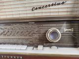 an old fashioned radio sitting on a table in a room