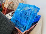 a pile of boxes and crates sitting on the floor