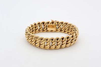 a gold bracelet with a braid design on a white background