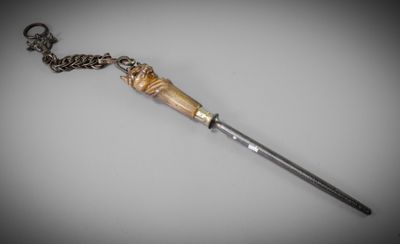 an image of a wooden stick with a chain on it