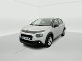 a white citrole car is parked in a white room