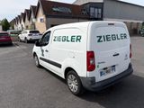 a white van that is parked in a parking lot