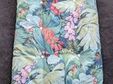 a close up of a sleeping bag with a flower pattern on it