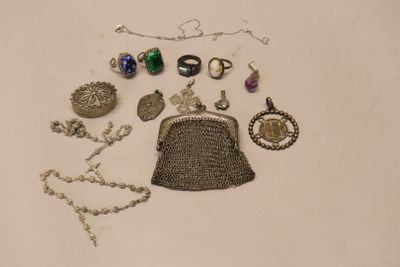 a lot of jewelry that is laying out on the table