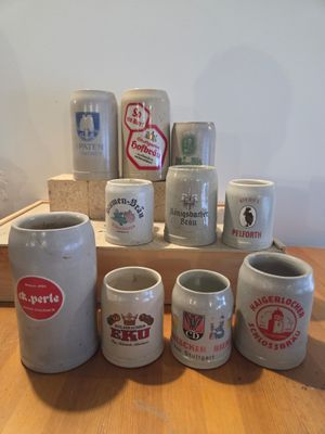 many different types of coffee mugs sitting on a table
