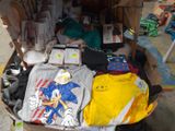 a box full of clothing and other items on the ground
