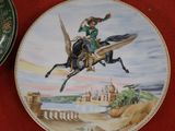 a plate with a picture of a woman riding a horse