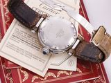 a watch sitting on top of a book on a table