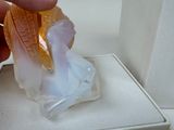 a person that is holding a piece of food in a box