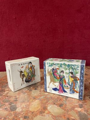 pair of chinese porcelain figurines of a man and a woman on horseback