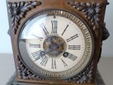 a clock that is sitting on a table in the room
