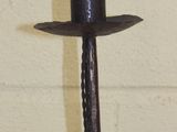 a candle that is sitting on top of a candle holder