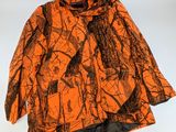 an orange and black jacket with a black bow on it