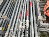 many different types of steel pipes stacked on top of each other