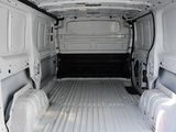 the interior of a white van with the doors open