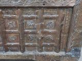 an old wooden chest with many drawers on it