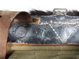 a close up of a bag with a leather handle