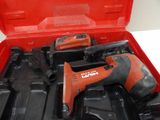 a red tool box with tools in it on a table