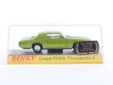 green die cast model of a car in a clear display case