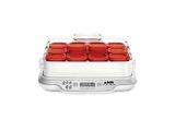 an image of a close up of a food warmer with red lids