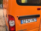 an orange van that is parked on the side of the road