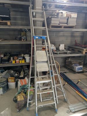 a ladder that is leaning against a wall in a garage