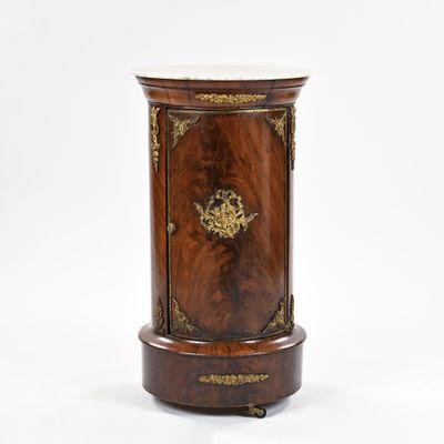an image of a small wooden cabinet with a marble top
