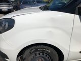 a white van that is parked in a parking lot