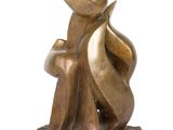 bronze sculpture of a man and a woman sitting on a rock