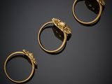 three gold rings with a lion head on each of them