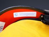 a close up of a yellow hat with a label on it