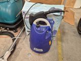 an image of a blue and black vacuum cleaner