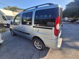 a silver van that is parked in a parking lot