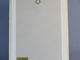 a painting of a white frame on a metal stand next to a blue wall