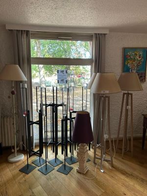 three lamps that are on the floor in the room