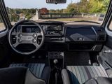 a view of the inside of a car from the driver ' s seat